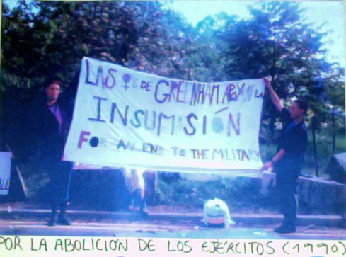 Emma and Nathalie hold the Insumisin Banner at Blue Gate